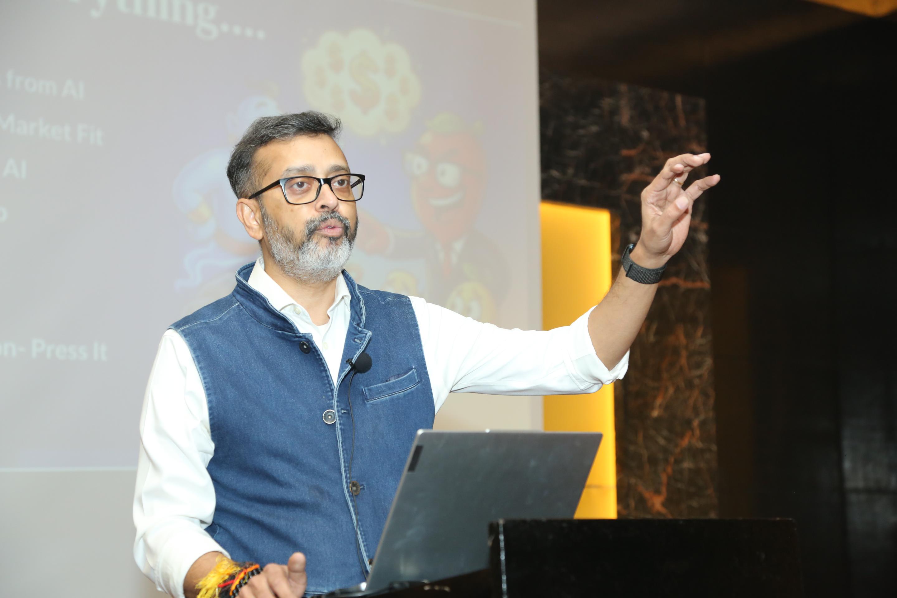 Audience listening to session on automating PRDs